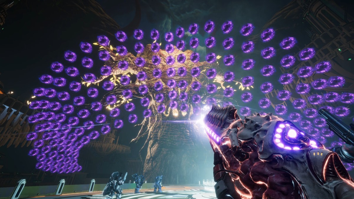 A boss firing a dense radial pattern of purple projectiles at the player