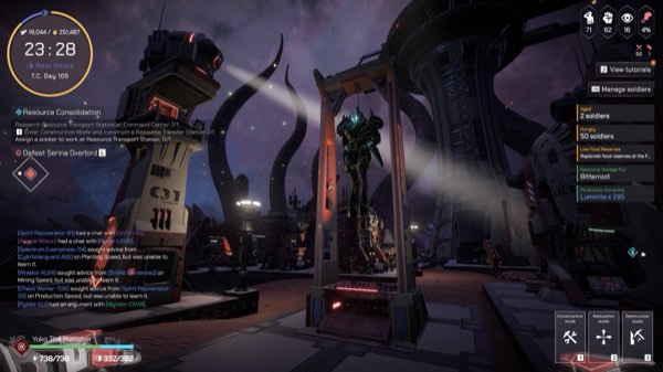 A colony at night lit by floodlights, with an execution gallows in the plaza